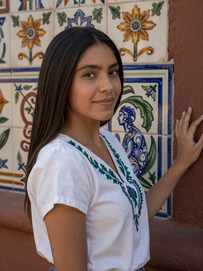 Gabriela, 26-year-old verified Mexican woman in traditional embroidered blouse near Puebla tiles